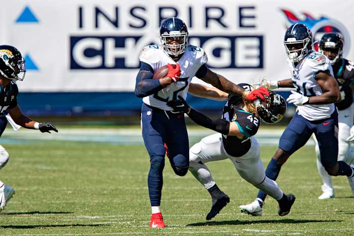 A stiff-arm from Henry—here in Week 2, plowing Jaguars safety Andrew Wingard—is a blast from the game's past.